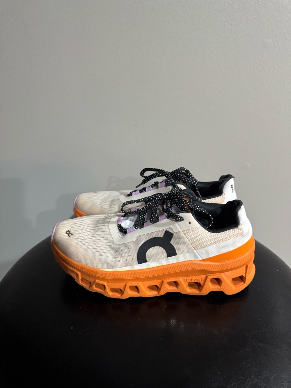 On Running Women’s Sneakers in White and Orange with Black Accents
